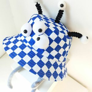 iconic plaid cartoon hat three eyes design youthful appeal 4468