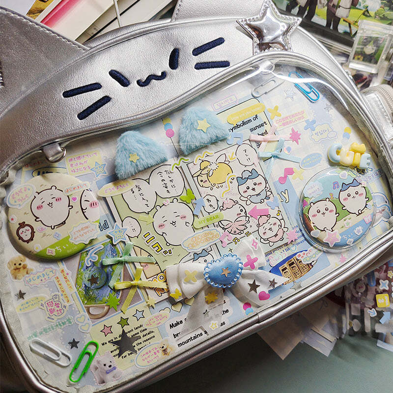 Silver Y2K Cat Backpack with Clear Window for Plushies and Pins Silver Y2K Cat Backpack with Clear Window for Plushies and Pins