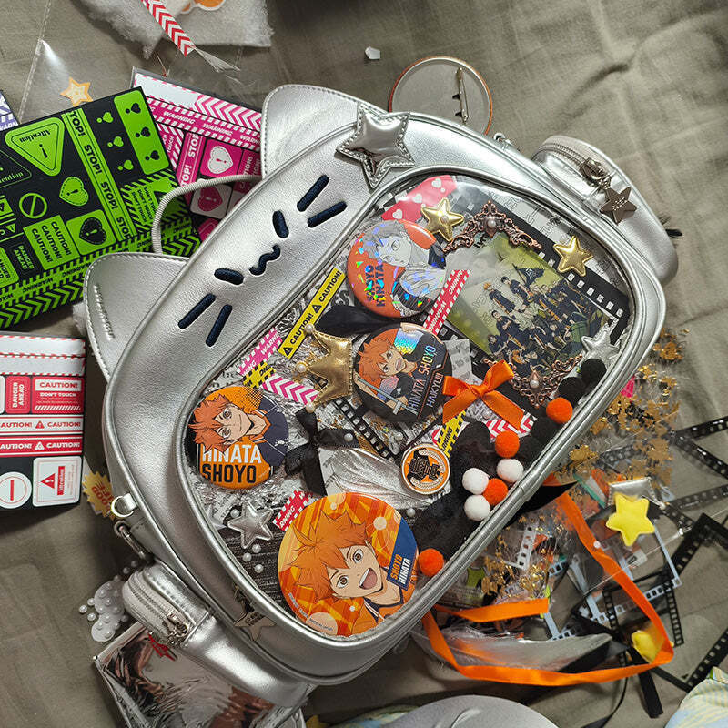 Silver Y2K Cat Backpack with Clear Window for Plushies and Pins Silver Y2K Cat Backpack with Clear Window for Plushies and Pins